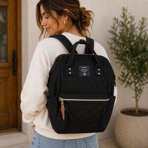 Anello Kuchigane Black Canvas Backpack Wide Opening Hinged Top Bag Gold Hardware